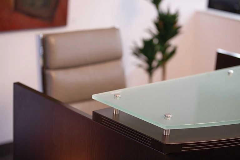Modern office desk with glass top